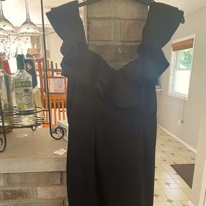 Black off the shoulder ruffle dress.